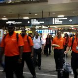 The team walks through the airport in Las Vegas heading to the MGM Grand to produce a 3 day conference.